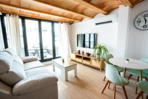 a living room with a couch and a table at House in the Old Town of Marbella with Private Pool and Free Parking in Marbella