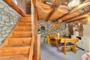 a kitchen with stairs and a table in a room at Villa Milla by aneo travel in Novi Vinodolski