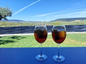 two glasses of wine sitting on a table at Casa turística en Navarrete in Navarrete