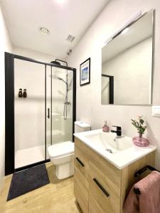 a bathroom with a shower and a sink and a toilet at Hostel Time Life in Nerja +12 photos