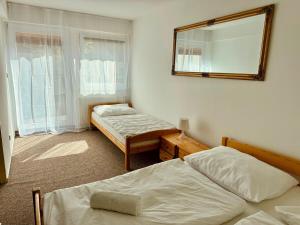 Postel nebo postele na pokoji v ubytování Penzion U Filipa