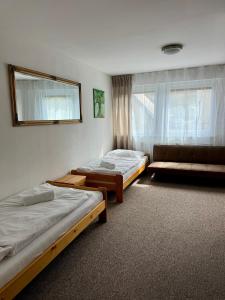 Postel nebo postele na pokoji v ubytování Penzion U Filipa