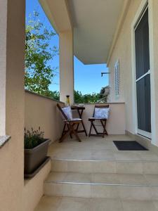 Ein Balkon oder eine Terrasse in der Unterkunft Apartmani Luka & Iva