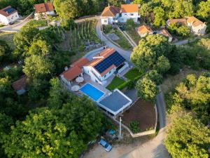 an overhead view of a house with a pool at Holiday house with a swimming pool Zmijavci, Zagora - 24240 in Zmijavci
