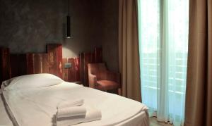 Postel nebo postele na pokoji v ubytování Crimea Wine Hotel