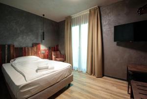 Postel nebo postele na pokoji v ubytování Crimea Wine Hotel