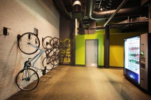 a room with bikes hanging on a wall at HI Boston Hostel in Boston