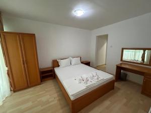 a small bedroom with a bed and a desk at Park Hotel Panorama in Tryavna +55 photos