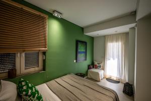 Postel nebo postele na pokoji v ubytování KazarneHouse