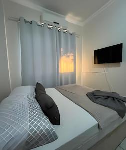 Ένα ή περισσότερα κρεβάτια σε δωμάτιο στο Estadias longa e tranquila - UEM