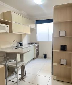 Η κουζίνα ή μικρή κουζίνα στο Estadias longa e tranquila - UEM