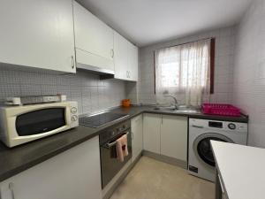 Kuchyň nebo kuchyňský kout v ubytování Apartamento pleno centro Benidorm