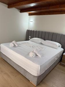 Postel nebo postele na pokoji v ubytování Rasu Apartments