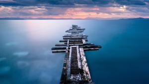 an aerial view of a pier in the water at Hostel da Penha in Vila Velha