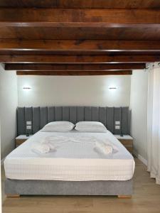 Postel nebo postele na pokoji v ubytování Rasu Apartments