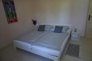 A bed or beds in a room at Villa Ida