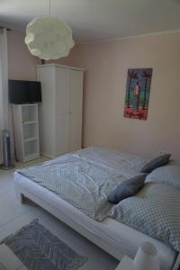 A bed or beds in a room at Villa Ida
