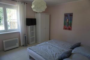 A bed or beds in a room at Villa Ida