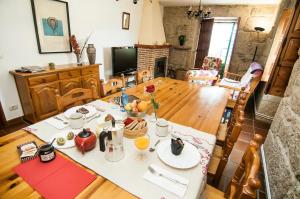 a dining room table with food on top of it at Casa Rural Rectoral de Areas Tui in Tui