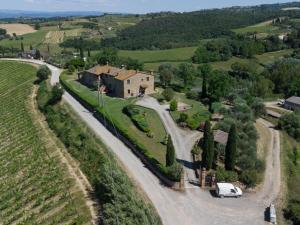 an aerial view of a farm with a white van on a road at Apartment Giotto by Interhome in Montaione