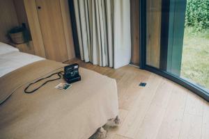 Voodi või voodid majutusasutuse LumiPod – Luxe glazen design‑pod toas