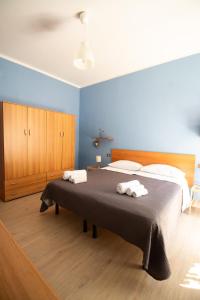 Кровать или кровати в номере Caleidoscopica Bahlara Ballarò