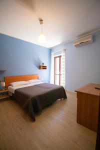 Кровать или кровати в номере Caleidoscopica Bahlara Ballarò +11 фотографий