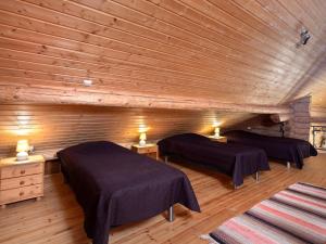 Postel nebo postele na pokoji v ubytování Holiday Home Ukkometso by Interhome