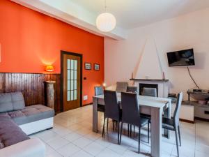 a living room with a table and a couch at Holiday Home Angela by Interhome in Perledo