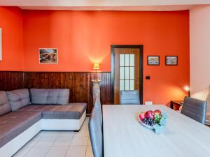 a living room with a table and a couch at Holiday Home Angela by Interhome in Perledo