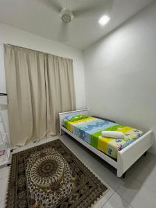 Ένα ή περισσότερα κρεβάτια σε δωμάτιο στο Muqryy Homestay