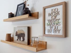 a pair of wooden shelves on a wall with a picture at Apartment Promenade - Utoring-19 by Interhome in Arosa