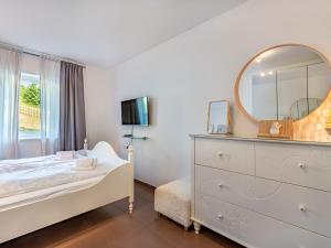 Uma cama ou camas num quarto em Apartment Simonhöhe Kärntentraum-1 by Interhome