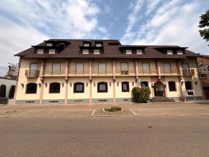 a large building with a brown roof at Hotel Rebstock in Rust