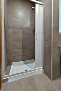 a shower with a glass door in a bathroom at Penthouse in St Julian's, 2 Beds,Terrace, 4px in St Julian's