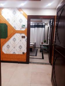 a room with a door leading to a bedroom at Dunleigh Apartments Murree in Murree +100 photos