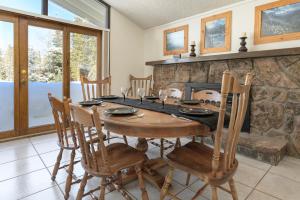 a dining room with a wooden table and chairs at 45 Idlewild in Winter Park +19 photos