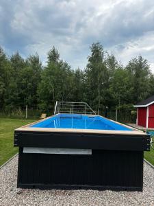 a large swimming pool on top of a building at Villa Jungle House - Mazury in Liwa +4 photos