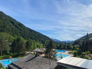 a view of a resort with a swimming pool at Appartement lumineux au ski pour 6 - Grand balcon, cœur du village - FR-1-458-96 in Le Grand-Bornand