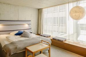 Giường trong phòng chung tại Nomad Design & Lifestyle Hotel
