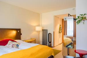 Giường trong phòng chung tại Nomad Design & Lifestyle Hotel