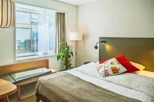 Giường trong phòng chung tại Nomad Design & Lifestyle Hotel