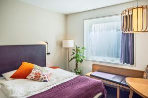Giường trong phòng chung tại Nomad Design & Lifestyle Hotel