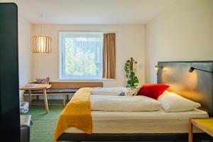 Giường trong phòng chung tại Nomad Design & Lifestyle Hotel