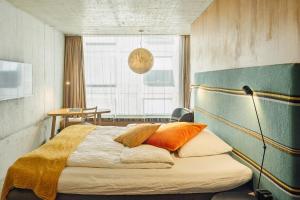 Giường trong phòng chung tại Nomad Design & Lifestyle Hotel