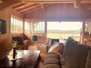 Χώρος καθιστικού στο Maison bois Lesbats