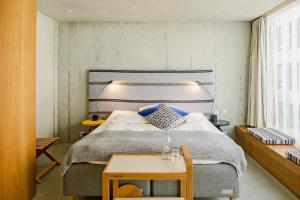 Giường trong phòng chung tại Nomad Design & Lifestyle Hotel