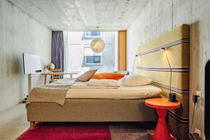 Giường trong phòng chung tại Nomad Design & Lifestyle Hotel