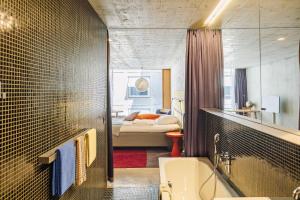 Giường trong phòng chung tại Nomad Design & Lifestyle Hotel