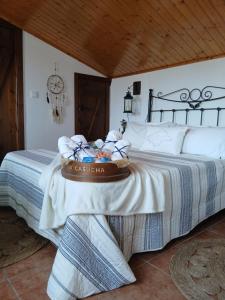 a bedroom with a bed with a basket on it at La Casucha junto al mar in Vilagarcia de Arousa